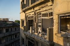 an old run down building with broken windows