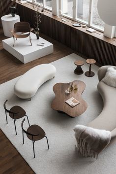 an aerial view of a living room with furniture and accessories on the carpeted floor