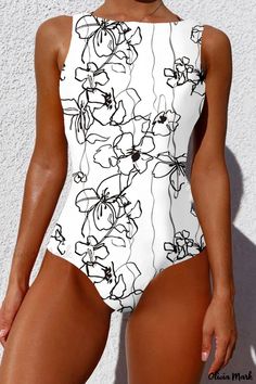 Olivia Mark - Contemporary Patchwork Swimsuit with Padded Support for Active Swimwear Enthusiasts White Sleeveless One-piece Swimsuit, Fitted White Sleeveless One Piece, White Fitted Bodysuit For Beach Season, Fitted White Bodysuit For Beach Season, White Printed Beachwear One-piece, Printed White Bodysuit For Vacation, White Printed Bodysuit For Vacation, Beach White Printed Bodysuit, White Floral Print One Piece Swimsuit