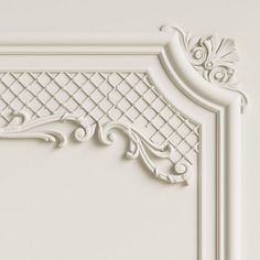 an ornate white frame on the wall