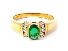 Item Specifications: Metal: 14k Yellow Gold Style: Statement Ring Ring Size: 6.25 (resizing available for a fee) Total Weight: 2.2 Grams Diamond Count: 6 Diamond Carat Weight: 0.12 Diamond Color: G-H Diamond Clarity: SI1-SI2 Gemstone Specifications: Gemstones: 1 oval green emerald Emerald Measurements: 5.94 mm x 4.18 mm x 2.65 mm Emerald Carat Weight: ~0.33 carats Condition: preowned excellent Stamped: "14KT"  Listing and template services provided by inkFrog Classic Multi-stone Yellow Gold Emerald Ring, Classic Multi-stone 14k Gold Diamond Ring, Classic Multi-stone Round Emerald Ring, Classic Multi-stone Emerald Ring, Classic Multi-stone Emerald Ring For Anniversary, Classic Multi-stone Emerald Ring For Formal Occasions, Emerald Gem, Diamond Carat, Stackable Ring