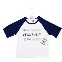 PREMIUM QUALITY: 3/4 sleeve t-shirt is made from 100% cotton and features humorous text on the front and navy sleeves. IN-HOUSE DESIGN: "Rule Breaker Mess Maker No Nap Taker" is screen printed on the front of the shirt. Comes packed in a plastic polybag on a white plastic hanger with an attached hangtag. CARE INSTRUCTIONS: Machine wash on the gentle cycle, with like colors in warm water. Do not bleach. Tumble dry low. Do not iron. Navy Cotton Screen Print Top, Cotton Half Sleeve Shirt With Graphic Print, Navy Cotton Tops With Letter Print, Navy Cotton Top With Letter Print, Navy Cotton Shirt With Graphic Print, Navy Cotton Graphic Print Shirt, Cotton Half Sleeve T-shirt With Letter Print, Casual Blue T-shirt With 3/4 Sleeves, Casual Blue 3/4 Sleeve T-shirt