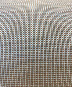 a close up view of a blue and white checkered pillow