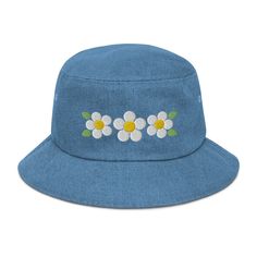 Puff Embroidered Three Daisy Denim Bucket Hat with white and yellow daisies. 100% Cotton. Poplin sweatband absorbs sweat. Practical, comfortable and fashionable hat. One size fits most. Gift for nature lovers, gardening, sun protection hat, and beach hat. Birthday gifts for women and gardeners. Made to order, ships in 2-7 days. Click and Order today to wear this springtime and summertime! Here's an accessory that'll become your main outfit piece. Get yourself this trendy, comfortable, and versatile bucket hat that'll work for all kinds of outfits--casual, sporty, and streetwear. * 100% cotton * 2 sewn eyelets on each side of the hat * Poplin sweatband * One size fits most * Blank product sourced from China For other daisy hats and gifts click here: https://www.etsy.com/shop/KristinCooperDe Casual Flower-shaped Sun Hat For Spring, Casual Flower Shaped Sun Hat For Spring, Casual Spring Sun Hat With Flower Shape, Casual Flower-shaped Sun Hat For Summer, Casual Flower Shaped Sun Hat For Summer, Casual Summer Sun Hat With Flower Shape, Spring Adjustable Denim Hats, Adjustable Denim Hats For Spring, Denim Bucket Hat For Spring