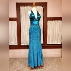 My Gowns Are Not Pre Owned. They Hey Have Not Been Worn. They Have Not Been Altered. This Brilliant Turquoise Blue Beaded Gown Is Gorgeous. The Halter Neck Gives You Support And Comfort. It Is Tagged A Size 4, But Zips Easily On Our Size 6 Dressform, So It May Be Cut Looser. Measures: Bust 36.5-37" Waist 26.5-27" Hips 37" It Has Been Stored Bagged And Hanging. Inside Labels Are Intact. Sparkle Dresses, Sparkle Dress, Beaded Gown, Turquoise Beads, Turquoise Blue, Halter Neck, Prom Dresses, Size 4, Prom