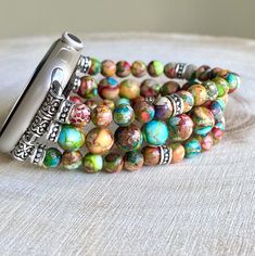 Multicolor jasper Beaded Apple Strap. rainbow/purple color. Bohemian Multicolor Adjustable Apple Watch Band, Adjustable Multicolor Apple Watch Band With Round Beads, Bohemian Multicolor Watch Bands As Gift, Bohemian Multicolor Bracelet Strap Watch Bands, Bohemian Adjustable Apple Watch Band With Round Beads, Bohemian Watch Bands With Bracelet Strap, Purple Jasper, Bracelet Apple Watch, Apple Watch Strap