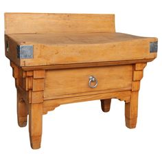 an old wooden bench with two drawers on one side and a drawer on the other