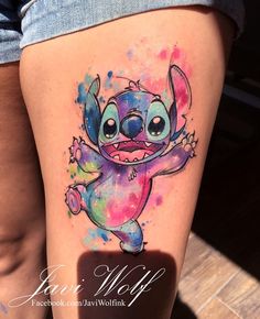 the tattoo is painted with watercolors and features an image of stitcher from stitch