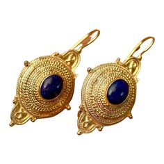 This design reveals its artistic credibility. These handcrafted earrings are reproductions of popular Victorian adaptations of a Roman design. Embellished with filigree threads, they come in your choice of diamond-cut amethyst, luminous opal, faceted citrine, cabochon lapis lazuli, onyx, blue topaz, baroque pearl or iridescent moonstone. 24k gold over sterling silver. European backs. Size: 1 3/4 inches. Roman Design, Ancient Roman Jewelry, Roman Jewelry, Lapis Earrings, Lapis Lazuli Earrings, Citrine Earrings, Blue Topaz Earrings, Topaz Earrings, Handcrafted Earrings