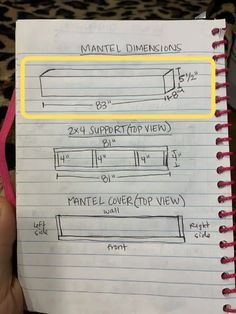 a hand holding up a notebook with instructions on how to use the pen and paper