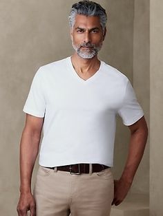 An elevated essential, this soft, 100% cotton tee is made with American-grown SUPIMA® cotton, a customer favorite beloved for its softness and strength.  Impeccably cut for an at-ease fit that's roomy without being too relaxed.  V-neck.  Short sleev White V Neck T Shirt Outfit, V Neck T Shirt Outfit, White V Neck T Shirt, Summer 24, Business Casual Men, Tshirt Outfits, Supima Cotton, Shirt Outfit, Mens Summer