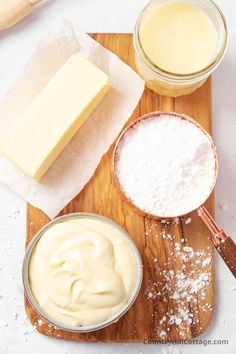 ingredients to make cheesecake sitting on a cutting board