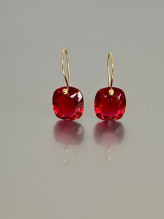 Beautiful red ruby earrings in Brilliant drops. The faceted rectangle drops have an amazing bright red color and are attached to 24K Gold Vermeil/ 14K SOLID GOD  ear wires.  The earrings are elegant, minimalist, and perfect to go with any outfit.   A truly gorgeous pair of earrings. When 14K SOLID GOLD ear wires are being used, the ear wire ends are hand stamped as proof of being 14K solid gold. In addition, extra work was done at the end of the ear wires to prevent any sort of pain or injury wh Red Faceted Jewelry For Formal Occasions, Formal Red Faceted Jewelry, Red Faceted Earrings For Anniversary, Red Square Cut Jewelry For Gift, Red Square Cut Jewelry Gift, Red Square Cut Jewelry For Formal Occasions, Rectangular Red Jewelry For Evening, Red Rectangular Jewelry For Evening, Formal Red Square Cut Jewelry