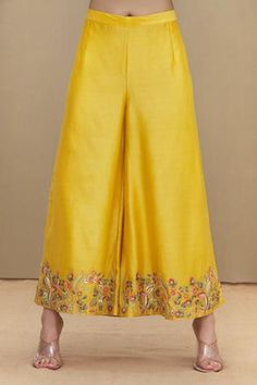 Mustard yellow straight kurta with all-over floral embroidery, flared sleeves and keyhole neckline. Comes with palazzo and shaded dupatta.
Component: 3
Embroidered
Neckline: Round
Sleeve Length: Full
Fabric: Kurta and Palazzo: Chanderi; Dupatta: Chiffon
Color: Yellow
Dori and thread embroidery
Straight kurta
Keyhole at the neckline with button closure
Frill detailing at the sleeves
Embroidered palazzo
Shaded dupatta with tassels at hem - Aza Fashions Silk Yellow Sharara With Floral Embroidery, Yellow Silk Sharara With Floral Embroidery, Silk Anarkali Set With Floral Embroidery In Yellow, Designer Yellow Sets With Motifs, Traditional Chanderi Palazzo Set With Motifs, Yellow Tussar Silk Sets For Transitional Season, Chiffon Embroidery, Kurta And Palazzo, Yellow Kurta