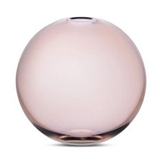 a pink glass vase sitting on top of a white table