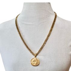 Unleash your inner strength and regality with the Cersei Amulet Necklace, a bold statement piece that exudes power and elegance. This luxurious necklace features a finely detailed lion emblem on a round pendant, symbolizing courage and authority. The pendant hangs from a sturdy, gold-plated curb chain that gleams with a rich luster, making it a standout accessory for any occasion. The necklace is completed with a sleek spike charm that adds an edgy touch, perfect for those who appreciate a mix o Luxurious Necklace, Lion Emblem, Halo Jewelry, Amulet Necklace, August Birthstone Jewelry, July Birthstone Jewelry, Zodiac Jewelry, Jewelry Ring Box, Pearl Jewellery Earrings