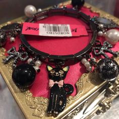 Vikki Vintage Black Cat Stretch Bracelet By Betsey Johnson It Has A Black Pearl Bead Band With Charms Faux Pearls La Femme Fatale Lace Beads ,Crystal Rhinestone Embedded Bows Hand Mirror Vanity Elegant Beaded Charm Bracelet For Party, Black Metal Bangle Charm Bracelet, Adjustable Black Charm Bracelet For Party, Adjustable Black Charm Bracelet For Parties, Black Costume Jewelry Bracelets As Gift, Elegant Black Bracelet With Lobster Clasp, Elegant Black Charm Bracelet For Gift, Elegant Black Charm Bracelet For Party, Elegant Black Metal Charm Bracelet