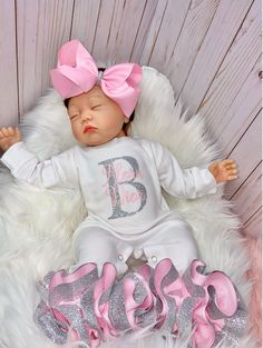 "100% COTTON This adorable customized outfit will have everyone in admiration of your little princess. This customized bodysuit is the perfect outfit for any occasion! Also offers an adorable large handmade ribbon bow with the perfect amount of sparkle and glam! The bodysuit is accented with matching handmade ribbon anklets (which are removable for easy cleaning and style changes, how awesome). The anklets offer the perfect fluffy look for your little one, which we receive endless compliments on Mommy And Me Coming Home Outfits, Customizable Cute Pink Onesie, Personalized Fitted Pink Onesie, Personalized Pink Onesie For Birthday, Personalized Pink Onesie For First Birthday, Customizable Fitted Pink Sets, Personalized White Cute Sets, Premie Clothes, Newborn Organization