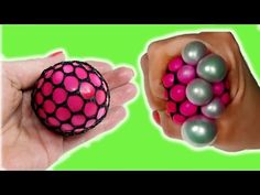 two hands holding small balls in one hand and the other with pink and grey balls on it