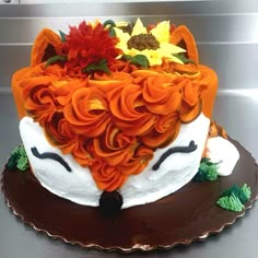 a cake decorated with flowers on top of a table