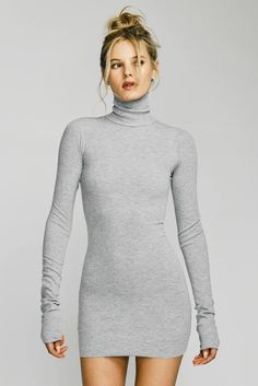 Cut from a butter soft ribbed cotton and model blend, our mini turtleneck dress is form-fitting, ultra flattering and lightweight. This mini dress is the perfect day to night essential. Style with your favorite oversized blazer or a pair of high knee boots. Size & Fit Information Fits true to size, take your normal size Designed for a slim fit 47% Cotton 47% Modal 6% Spandex Model is 177 cm/5'10" and is wearing a size S Machine wash cold. Non-chlorine bleach. Tumble dry low. Cool iron. Do not dr Turtleneck Short Sleeve Dress, Dresses For Grey Knee High Boots, Petite Bodycon Sweater Dress Mini, Luxury Fitted Turtleneck Sweater Dress, Grey Turtle Neck Sweater Dress, Best Dress Websites, White Turtleneck Dress, Black Turtleneck Sweater Dress, High Knee Boots