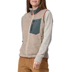 evo.com | Patagonia Vests > The Patagonia Classic Retro-X® Vest is a classic for a reason. Made from fuzzy and warm bonded shearling fleece, it's the cozy layering piece your wardrobe has been missing. Throw it over your favorite shirt or sweater and prepare yourself for endless compliments. Vertical Zippered Nylon Chest Pocket Regular Fit Neither slim nor oversized. Regular-fitting technical garments may be worn over heavier midlayers. Full Front Zip w/ Internal Wind Flap Fleece 12.9 oz 100% Po Patagonia Vest Outfit, Vest Patagonia, Patagonia Vest, Womens Outdoor Clothing, Vest Outfit, Winter Running, Layered Shirts, Moon Boots, Outdoor Men