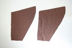 two pieces of brown fabric sitting next to each other