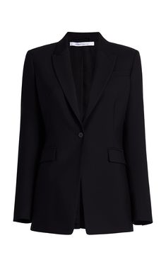 This classic single-button blazer features a peaked lapel and is nipped at the waist to add shape to the silhouette. Soft to the touch and seasonless, our custom-crafted merino wool is traceable to the farm.We have visited our wool-supplying farms to ensure that their sheep are raised and sheared in exemplary conditions, free of the cruel practice of mulesing. The fibers for this garment come from a farm in New South Wales. The fabric is processed and finished in an Italian facility that runs on Work Suits, Single Button Blazer, Button Jacket, Black Turtleneck, High Fashion Street Style, Notched Collar, Black Blazer, Blazer Buttons, Jacket Buttons