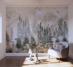 an empty room with a rocking chair in front of a wall mural that has trees and birds on it