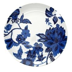 a blue and white plate with flowers on it