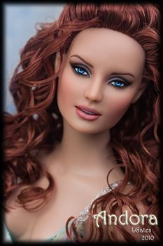 a doll with long red hair and blue eyes is posed for the camera, wearing a tiara