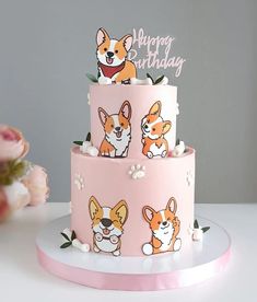 a pink birthday cake with corgi on it and the words happy birthday written on top