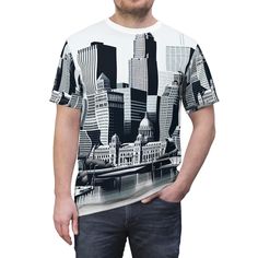 This American city-themed tee exudes a cool and urban vibe, perfect for casual outings and everyday wear. Ideal for city dwellers, travel enthusiasts, and anyone who loves American culture and landmarks. Great for Fourth of July celebrations, city events, and patriotic holidays. Product features - 100% Polyester fabric - Side seams for structural support - Ribbed knit collar for elasticity - Shoulder tape for stability - Regular fit Care instructions - Do not dryclean - Do not iron - Tumble dry: low heat - Do not bleach - Machine wash: cold (max 30C or 90F), gentle cycle Urban Tees, American City, Patriotic Shirt, American Culture, American Cities, Patriotic Shirts, Usa Travel, Graphic Shirts, Travel Usa