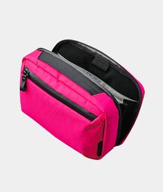 The Elements Tech Case Max is designed to keep you clutter-free and it can transform into a sling helping you stay hands-free when on the go. Easy access with plenty of internal space and exceptional organization to fit your daily needs. Can also be used as a desk organizer. Limited Edition Hot Pink X-Pac® RVX20 fabric 100% recycled post consumer PET fabric. 210D grey x-grid ripstop lining Transforms into a sling bag (strap included) Accordion-style organization Fits an iPad Mini 6 Fits a foldable headphones 840D Ballistic Nylon back panel 12 thoughtfully designed pockets across 3 compartments Weatherproof fabrics and YKK zippers Integrated carry handle Cable pass-through Compatible with the Magnetic Stabilizer Strap Tech Cases, Fashion Organization, Desk Organizer, Clutter Free, Desk Organization, Sling Bag, Bag Straps, Hands Free, Ipad Mini