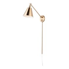 a brass colored floor lamp with a white light on the side and a gold shade