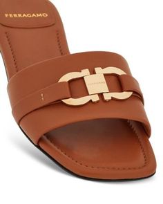 Ferragamo Women's Leah Gancini Slide Sandals Designer Brown Sandals With Tang Buckle, Calf Leather Sandals With Tang Buckle, Flat Sandals With Tang Buckle, Luxury Sandals With Tang Buckle And Open Heel, Luxury Formal Sandals With Tang Buckle, Luxury Flat Sandals With Tang Buckle, Brown Flat Sandals For Evening, Elegant Closed Toe Sandals With Tang Buckle, Designer Flat Sandals For Formal Occasions