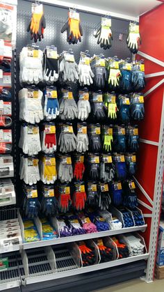 the shelves are filled with many pairs of gloves for children to wear on their hands