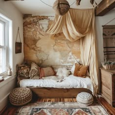 a bedroom with a map on the wall next to a bed and rug in front of it