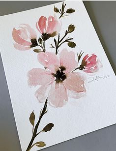 watercolor painting of pink flowers on white paper