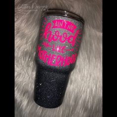 a black and pink glitter tumbler cup with the words, i am proud on it