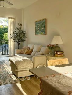 a living room filled with furniture and a balcony