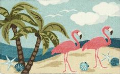 two pink flamingos are standing on the beach with palm trees and seashells