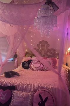 a bed with pink and purple decor in a bedroom