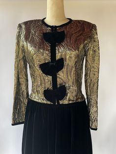 Up for your consideration is this super pretty, fun and unique gold foil holiday cocktail dress by Eliza Scott. Marked size 10. Made in the USA. This dress has shoulder pads, and a zip down back with hook and eye closure. In excellent vintage condition from the 1980's.  Please be sure to see all photos, read all measurements, and ask any unanswered questions before purchasing! *Estimated best fit: Large *Shoulder: 17" *Sleeve: 24" *Pit to pit: 19" lying flat | 38"  *Waist: 33"  *Length: 50" | 20" top, 30" skirt Thanks for looking! www.shopbadcatvintage.com Instagram: BADCATVINTAGE Second Etsy Shop:  www.etsy.com/shop/sureshotvintage LOT 02 Holiday Cocktail Dress, Cocktail Dress Holiday, Unanswered Questions, Cocktail Formal, Holiday Cocktail, Velvet Skirt, New Years Party, Nouvel An, Holiday Christmas