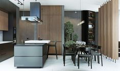 a modern kitchen and dining room with wood paneling