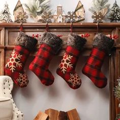 three christmas stockings hanging from a mantle