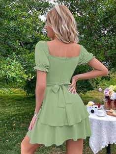 The ncocon green shift dress is perfect for any occasion, whether it's work or play! The lightweight woven poly fabric features a charming shift skirt, with a V-neckline and short flounce sleeves. The dress has a princess-seamed bodice, full button placket, and a tying waist sash for a flattering fit, and a flared skirt completes the look. Fabric name: polyesterPattern: solid colorTechnology: collage/splicingSkirt length: short skirtSkirt type: lotus leaf skirtCollar type: square collarSleeve ty Technology Collage, Sleeve Green Dress, Shift Skirt, Elegant Silk Dresses, Leaf Skirt, Green Shift Dress, Dramatic Sleeves, Waist Sash, Silk Wrap Dresses