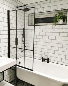 White metro tiles styled with dark grey grout, black accessories, grid shower screen. Corner roll top bath with black claw feet. Bathtub With Shower Screen, Pantry Design Ikea, Dining Room Design Farmhouse, Small Bathroom With Bath, Bathroom Screen, Ice Screen, Bathtub Screen, Bedroom Pantry, Walnut House