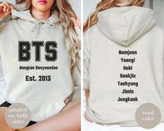 BTS Bangtan Hoodie Sweatshirt, Kpop Gildan 18500 Hooded Sweatshirt, gift for army BTS fan, Namjoon, Jungkook, Yoongi, Jin, Taehyung, Hobi So soft and comfy BTS Bangtan Hooded Gildan 18500 Sweatshirt! Printed on front and back! Backside has members names. Great hoodie for you or gift for a fellow Army!  Whether you're hitting the gym, running errands, or just lounging at home, our BTS sweatshirt is perfect! Kangaroo pouch pocket will always keep your hands warm!  Stay cozy while you wait for thei Kpop Style Hoodie With Letter Print, Kpop Hoodie With Letter Print For Fall, Kpop Style Hoodie With Letter Print For Fall, Kpop Cotton Hoodie With Letter Print, Kpop Style Cotton Hoodie With Letter Print, Army Bts, Bts Fans, Kangaroo Pouch, Jimin Jungkook