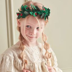 This headband is topped with soft green felt leaves and bright red pompom berries, perfect to wear to Christmas parties or for imaginative dress up. The headband is wrapped with green gingham ribbon for a stylish effect. The ideal hair accessory to instantly make you look and feel festive. Green felt leaves Red pompom berries A flexible metal headband wrapped with green gingham ribbon Suitable for ages 3+ Product dimensions: 5.75 x 6.5 x 0.75 inches Pack dimensions: 5.75 x 6.5 x 0.75 inches by M Felt Holly, Christmas Hair Accessories, Headband Wrap, Kids Room Wall Decals, Felt Leaves, Green Gingham, Christmas Headband, Meri Meri, Metal Headbands